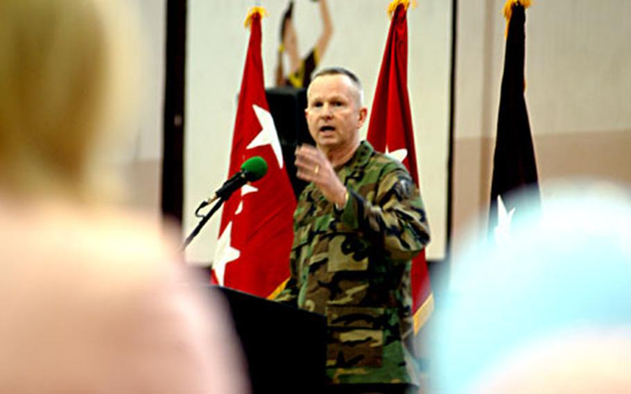 Gen. B.B. Bell, commander of the U.S. Army in Europe, addresses Shand Mayville, left, during a speech at a dedication ceremony for a new, $8 million birth center scheduled to open on base next month. Mayville, wife of Col. Bill Mayville, was instumental in convincing Bell to deliver the center to the base, Bell said.
