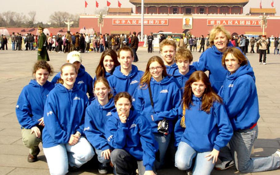 The Heidelberg High School delegation to the 12th annual Beijing Model United Nations Conference assemble in Tianamen Square. Back row, from left: Elisabeth Wilhelm, Tyler Botters, Melissa Sidwell, Brian Mueller, Jeff Rubino and sponsor Karen Primmer. In front, from left: Alexis Kuiper, Ashley McConaughey, Erin McConaughey, Katie MacEwen, Tyler Anger, Tera Brosnan and Alex Wood.