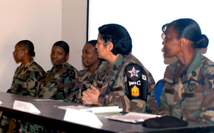 Female first sergeants speak at a Women’s History Month event Thursday at Camp Casey, South Korea. The first sergeants advised young female soldiers to delay having children until they are ready to leave the Army or have established careers.
