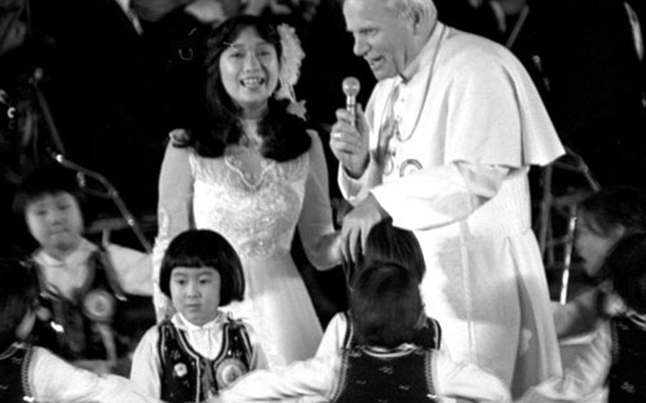 Pope John Paul II at Tokyo&#39;s Budokan Hall during a trip to Japan in 1981. John Paul II, who died Saturday at age 84, traveled to 130 countries on 102 visits outside of Italy during his papacy. Stars and Stripes photographers and writers documented  throughout the years.