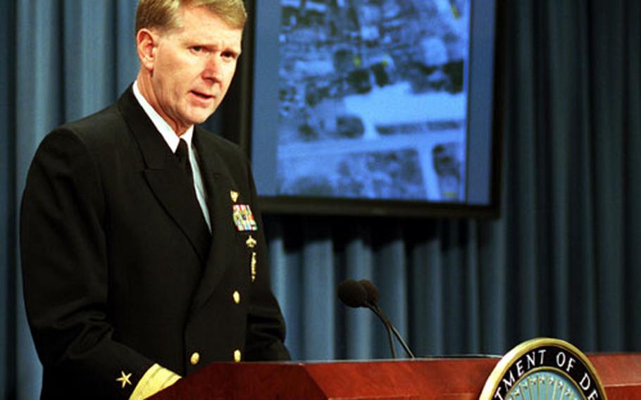 Navy Rear Adm. John D. Stufflebeem gives reporters an update on the missions in Afghanistan during a Pentagon press briefing in November, 2001.