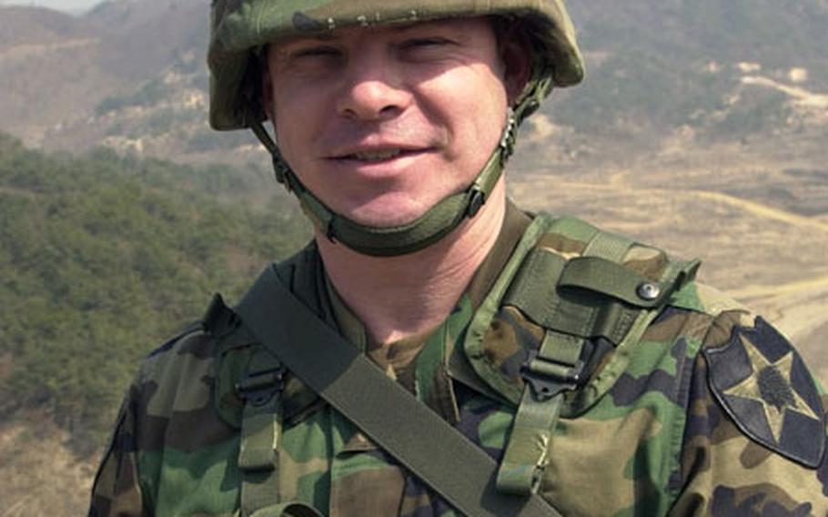 Sgt. 1st Class Donald Eacho, with the 1st Battalion, 9th Infantry Regiment, wears the Soldier’s Medal after a pinning ceremony in March 2004 during a break from gunnery training at Rodriguez Range in South Korea. Eacho helped save a 4-year-old girl and her grandfather trapped in a burning car in 2003 while he was on duty in Pennsylvania.