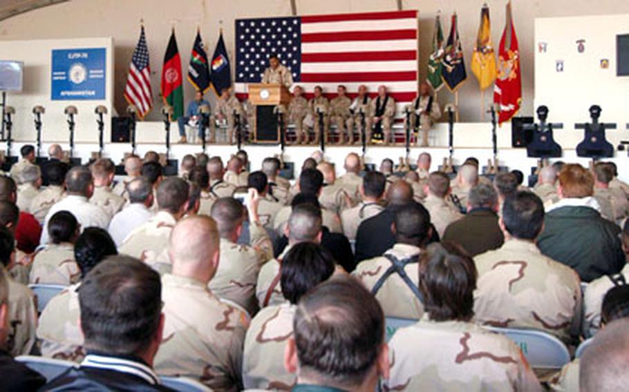 Combined/Joint Task Force-76 Command Sgt. Major Iuniasolua Savusa reads Scripture at the memorial service at Bagram Air Base.