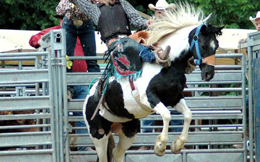 Christopher Hebert, a former soldier and now a government civilian worker, rides a bronco during a rodeo in Seelitz in eastern Germany last summer. The European Rodeo Cowboy Association has more than 500 American and German members who compete in both European and association events.