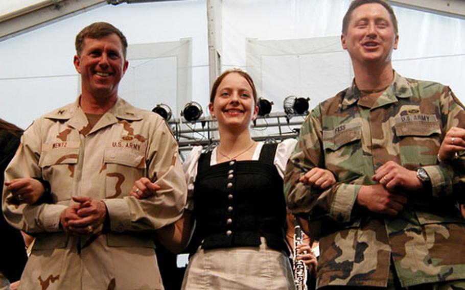 Col. Paul Wentz, left, commander of the Big Red One’s Division support command, and Lt. Col. Thomas Fass, commander of the 417th Base Support Battalion, danced with a German polka band Friday during the 417th BSB’s welcome-home party for 1st Infantry Division troops in Kitzingen.