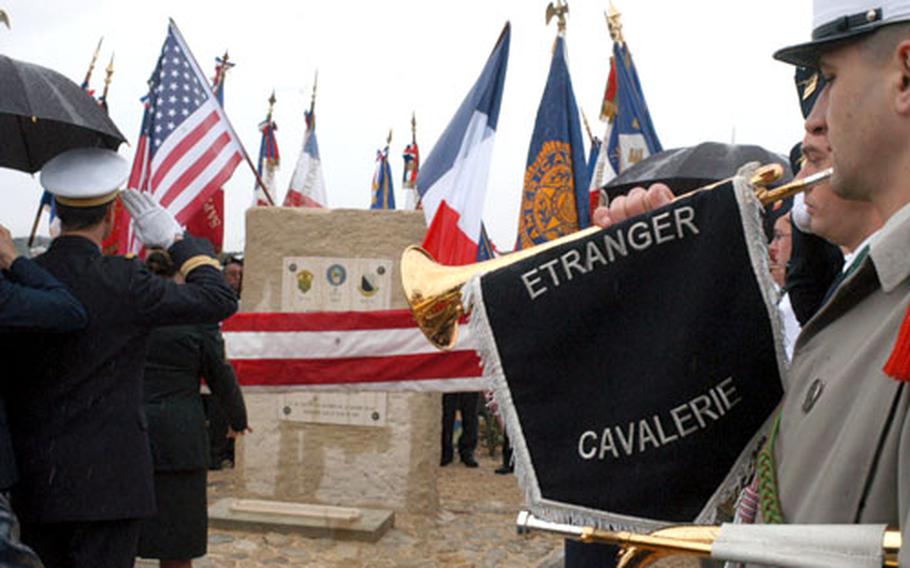 A French bugler prepares to play Saturday at Plan de Dieu, France, as local and American military members unveil a new memorial to five U.S. pilots downed in the area in the summer of 1944.