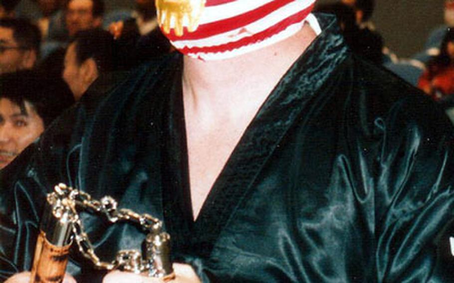 Senior Chief Petty Officer Glen Holbrook, in his "bad guy" American Ninja wrestling costume at a recent Japanese professional wrestling event.