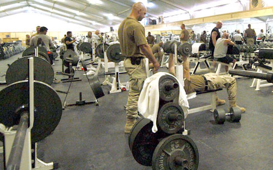 Soldiers stay in shape at the busy fitness center at Kandahar Airfield