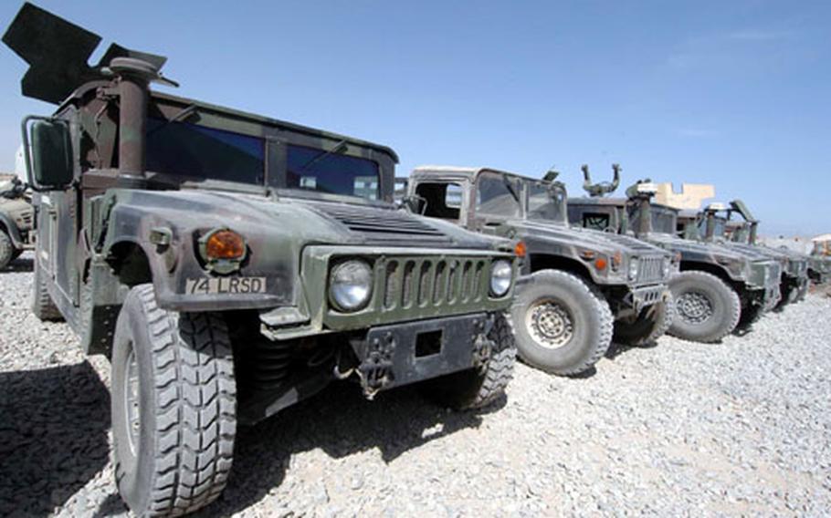 Humvees of the 173rd Airborne Brigade’s 74th Long Range Surveillance Detachment are parked at Kandahar airfield. Mechanics with the 173rd say Afghanistan’s rough roads, dust and heat leave them with plenty of work to do on the brigade’s vehicles.
