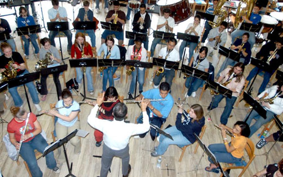 Anthony Maiello, a guest conductor from George Mason University in Fairfax, Va., leads 60 Department of Defense Dependents Schools children from nine countries during the Honors Music Festival in Germany.