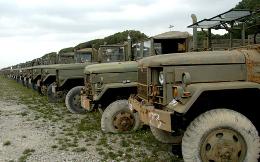 U.S. Army trucks from previous wars are stored outdoors at Field Support Battalion- Livorno, Italy, until they are sold to other governments.