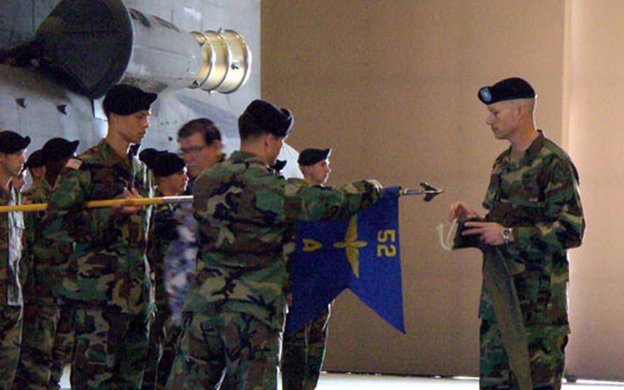 Soldiers of Company A, 2nd Battalion, 52nd Aviation Regiment hold a re-flagging ceremony Monday at Camp Humphreys, South Korea. The unit is to depart South Korea next month for Fort Hood to become the Chinook helicopter company within the 1st Cavalry Division’s aviation brigade. At right is Maj. Thomas Jessee, the company’s commander.