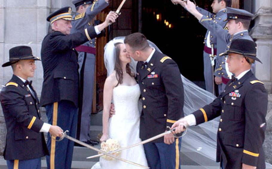 First Lt. Derek Ping and wife Jamie kiss outside of a chapel at West Point following their religious wedding ceremony April 8. They received their civil marriage certificate five months earlier, thanks to a Montana law that allows couples to be married without appearing in person.