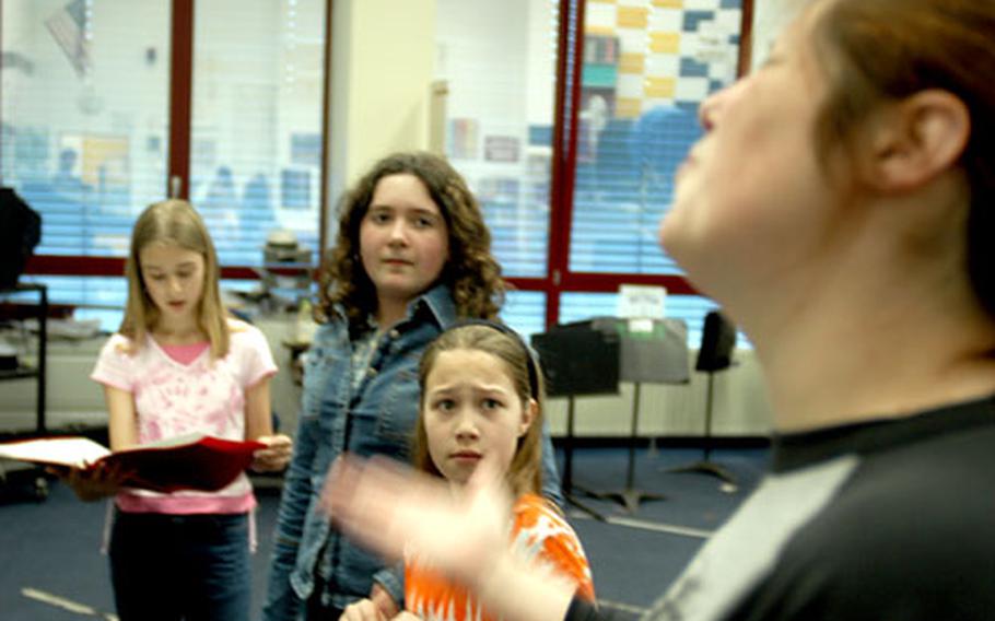 Amy Lariviere, right, an actor/director with the Missoula Children’s Theatre, rehearses with, from right, fourth-grader Megan Campbell, eighth-grader Kaitlyn Collums and sixth-grader Leah Duke. In the play, a Western-themed version of “The Wizard of Oz,” Kaitlyn plays the main character, Dotty; Megan is her dog Mooch; and Leah plays Scared Crow.