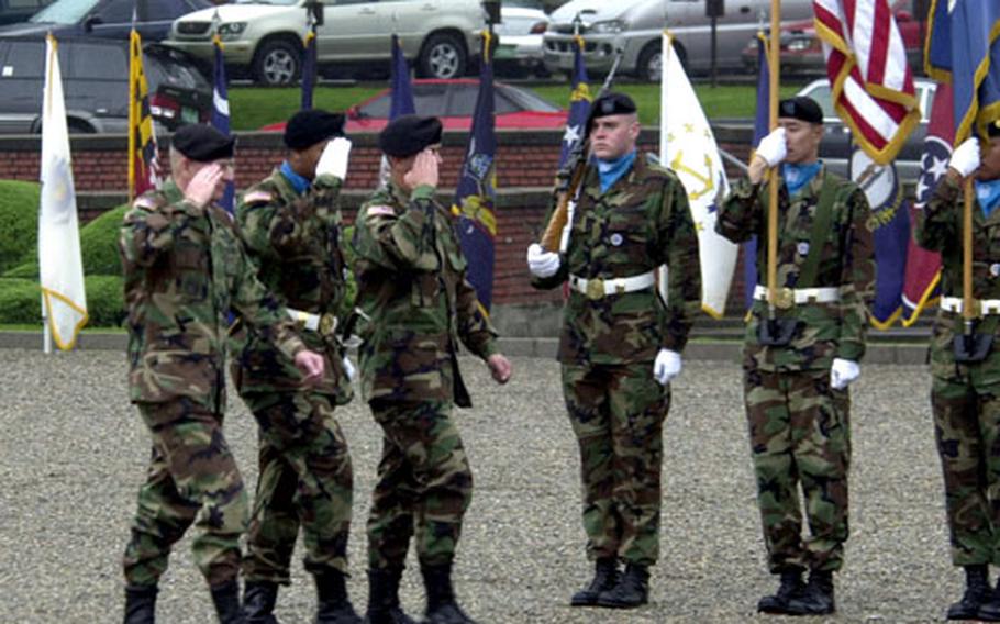 Wheeler, left, Honor Guard Company Executive Officer Capt. Derrick Goodwin, center, and Command Sgt. Maj. Troy Welch review the troops during a change-of-responsibility ceremony Friday at Yongsan Garrison, South Korea.