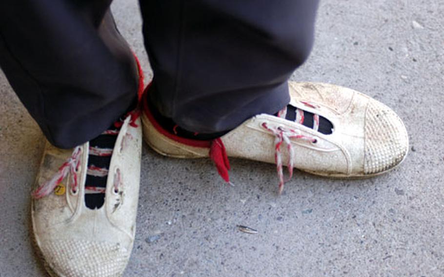 Thanks to a team of soldiers, Bahroz Raheem Qader, 11, now has new shoes to replace this pair of battered white sneakers. On Monday, a team of Army soldiers based in Sulaymaniyah began passing out 800 pairs of shoes to kids living in rural villages near the Iraq-Iran border.