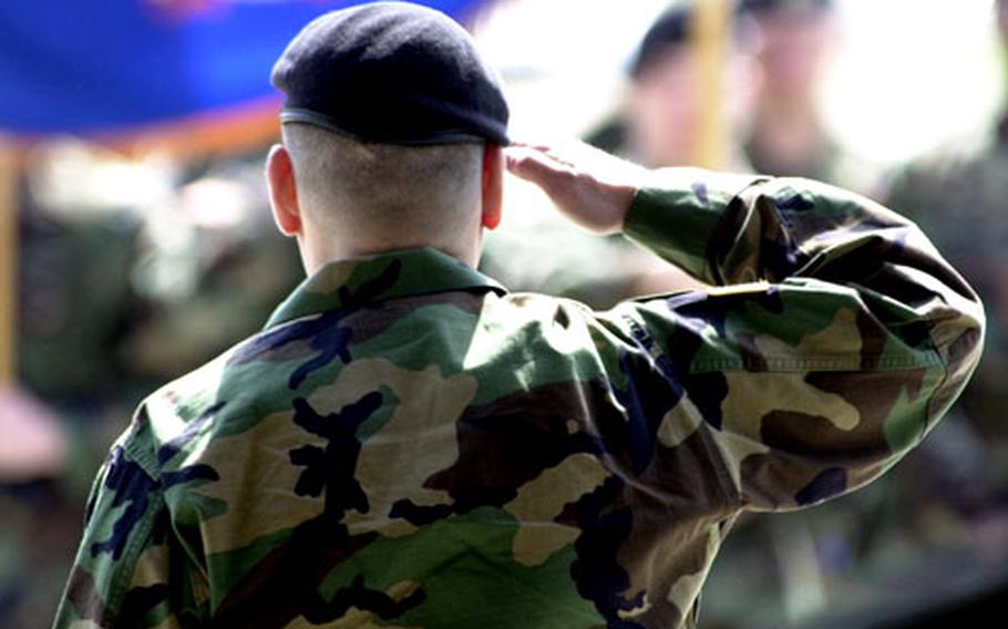 Lt. Col. Fred Manzo, Jr. salutes his formation during Friday&#39;s casing ceremony. “This ceremony is about you,” he told troops."