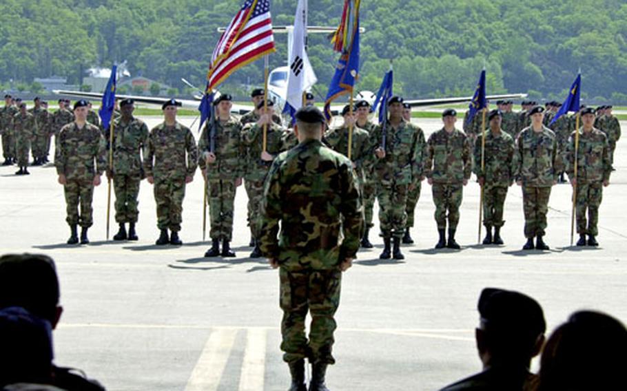 Lt. Col. Fred Manzo Jr., 1st Battalion, 52nd Aviation Regiment commander, observes his formation during a casing ceremony Friday at K-16, Seoul Air Base.