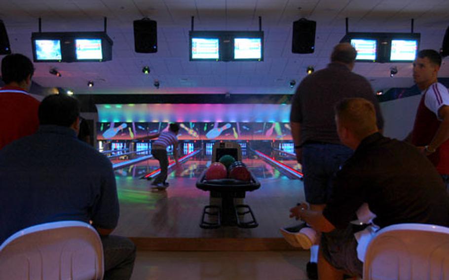 The new Sigonella bowling center at Midtown Morale, Welfare and Recreation complex, which also features a two-screen movie theater, swimming pool and gym, complete with indoor running track and climbing wall. (enw# 61p pp)