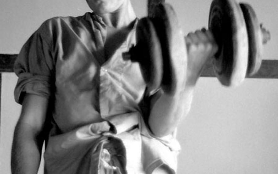 Sp4 Harold Maples, unassigned, of Sevierville, Tenn., lifts weights at the 6th Convalescent Center.