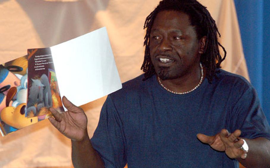 Jerry Bowens of the Giessen child development center reads to the kids at "Stories in the Park."