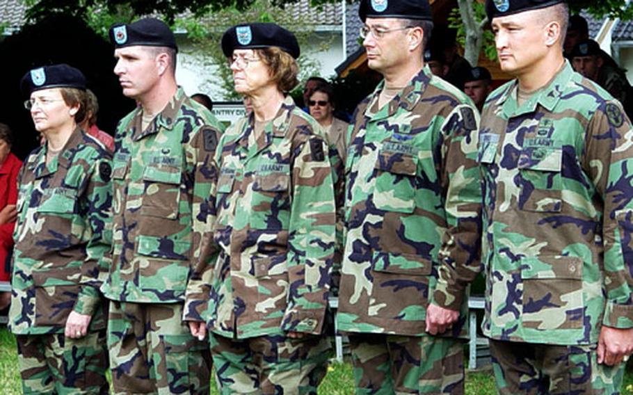 A change of command Wednesday at Leighton Barracks in Würzburg, Germany, reflects a fundamental restructuring of the Würzburg Army Hospital. From left are Dr. (Brig. Gen.) Carla G. Hawley-Boland, commander, Europe Regional Medical Command and U.S. Army Europe surgeon general; Dr. (Col.) Steven W. Swann, commander of the 30th Medical Brigade; Dr. (Col.) Patricia K. Lillis-Hearne, outgoing commander of the 67th Combat Support Hospital; Col. Mark H. Bither, incoming commander of the 67th CSH; and Dr. Col. Dallas W. Homas, incoming commander of the U.S. Army Medical Department Activity (MEDAC) Würzburg.