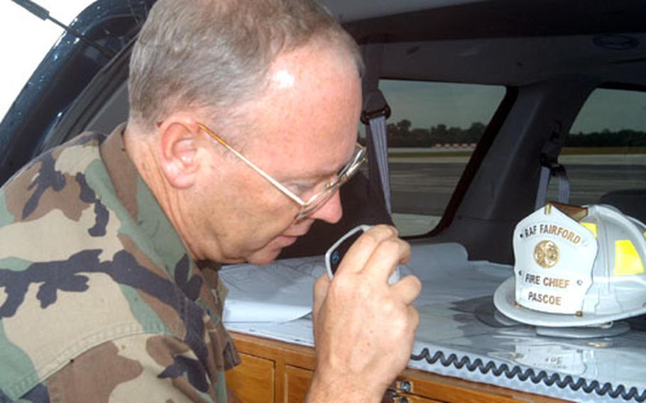 Lt. Col. Tom Gill, deputy commander of the 420th Air Base Group at RAF Fairford, England, talks to the base control tower Tuesday during the launch of the space shuttle. Gill was commander of the effort at the base to secure the shuttle had it needed to use the base.