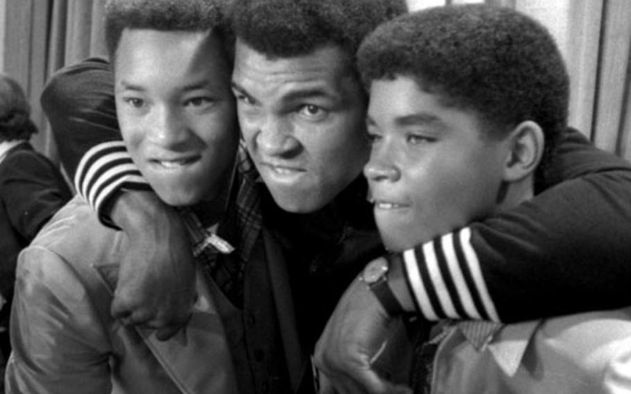 Muhammad Ali poses with Phillip McAllister, bottom photo left, and James Leroy Smith, who play him in his younger days in ''The Greatest.''