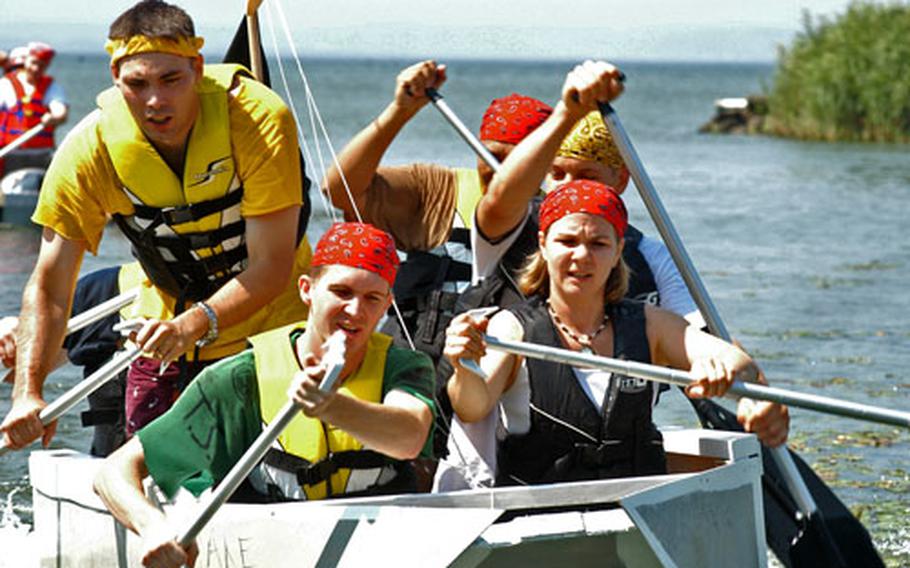 A team of sailors from Naval Air Facility Misawa’s operations department paddles into shore and first place. The team, in its simplistic wooden, bath-tub shaped boat, took home top honors.