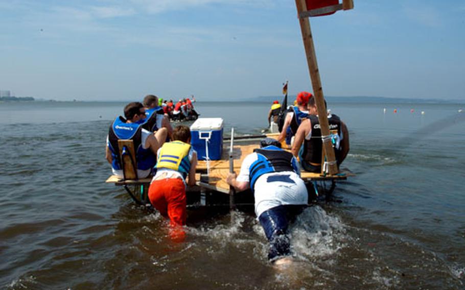 A team from the Aircraft Intermediate Maintenance Department try to get their bicycle-pedal-powered pontoon moving. Though voted most innovative, the metal-laden boat wasn&#39;t very buoyant.