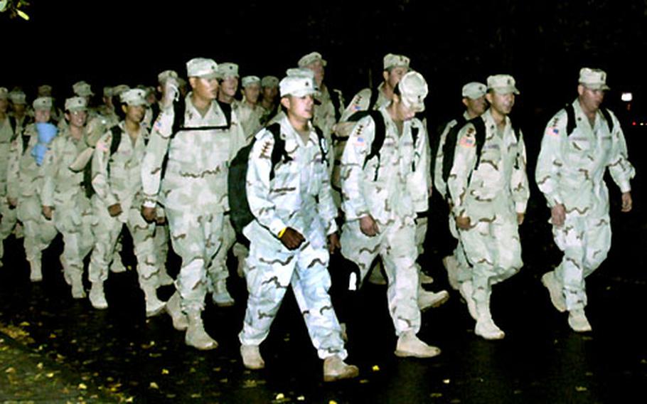 Soldiers from the 502nd Engineer Co. march to the gym on Pioneer Kaserne, Hanau, after returning Monday from a year-long deployment in Iraq.