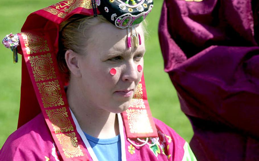 Maj. Stacie Hatten participates in the re-creation of a traditional Korean wedding.