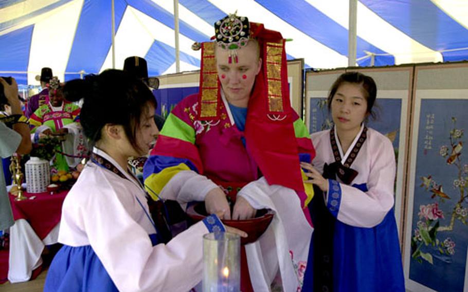 Maj. Stacie Hatten gets ready for the re-creation of a traditional Korean wedding.