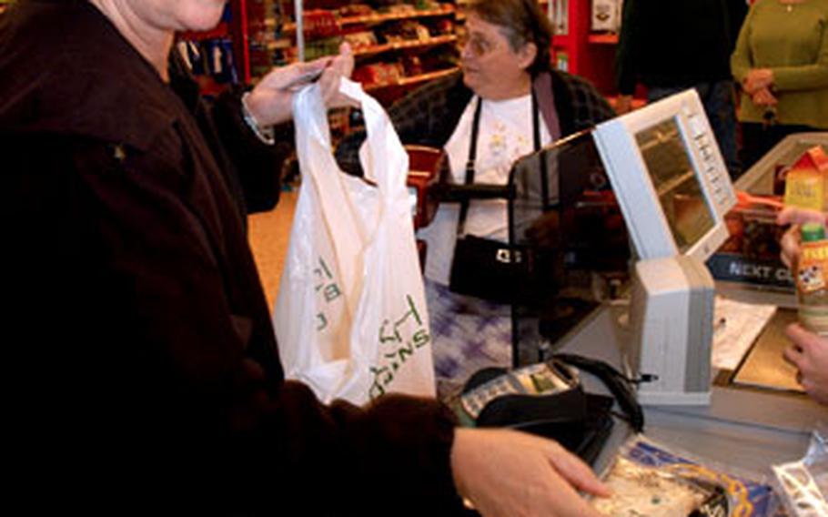 Dawna Webb buys groceries at Budgen’s in downtown Mildenhall. Webb, who lives in Mildenhall with her husband, said she buys most groceries at the base commissary to save money and goes to local stores only for things she can’t find on base.