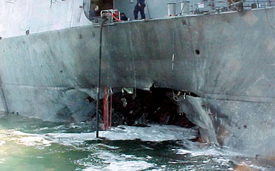 A port side view showing the damage sustained by the Arleigh Burke class guided missile destroyer USS Cole after suicide bombers slammed an explosives-laden boat into the side during a refueling operation in the port of Aden, Yemen, on Oct. 12, 2000. Recent developments in unmanned, autonomous systems mean they can now be used to support a wide range of missions, including security and perimeter defense at ports and other areas where large ships are vulnerable.