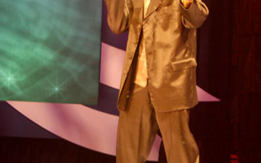 Spc. Festus Togbeola of the 177th Armored Battalion in Schweinfurt sings “Stand By Me” during the Military Idol finals at Fort Gordon, Georgia, on Saturday.