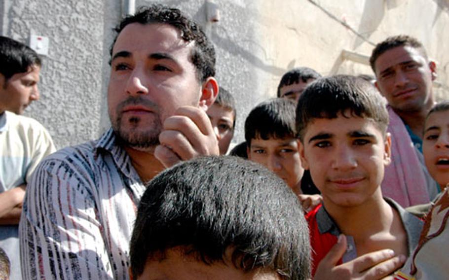 Eastern Baghdad resident Hussam Qassam, 24, says he appreciates his family&#39;s new water spigot. "In 35 years we live here in this city, the first project we&#39;ve seen is the water project," he said. "It&#39;s good."