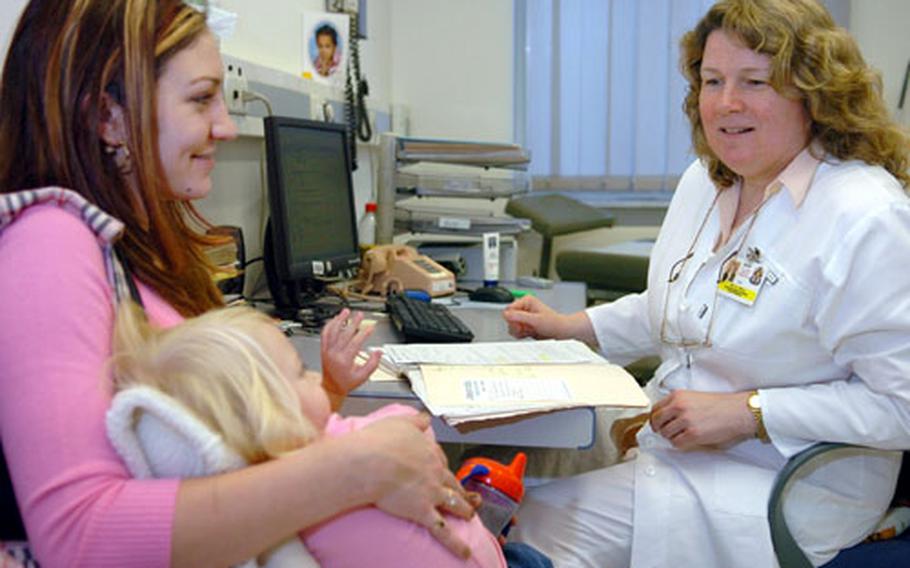 Dr. Regine Malo, right, chats with patient Erin Barnes and her daughter, Destiny, at the Darmstadt Clinic on Monday. The European Regional Medical Command reports that approximately 5,000 patients fail to show up for scheduled medical appointments each month.