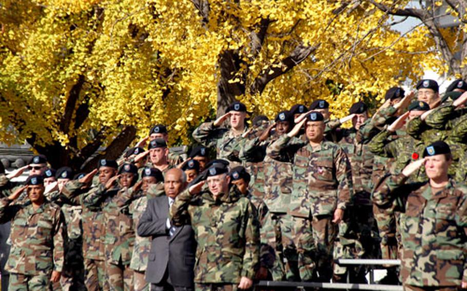 U.S. servicemembers stand at attention during the National Anthem at Monday’s ceremony on Yongsan Garrison.