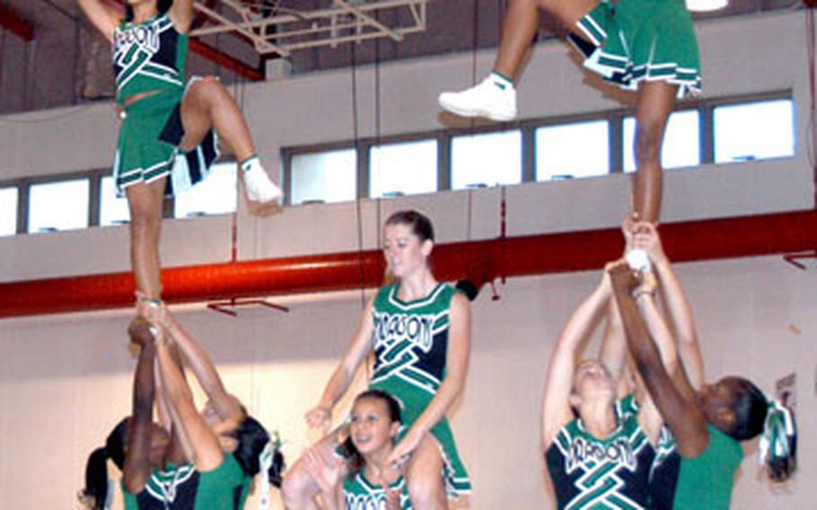 The Kubasaki Dragons from Camp Foster, Okinawa, perform a stunt. Kubasaki won the large school title.