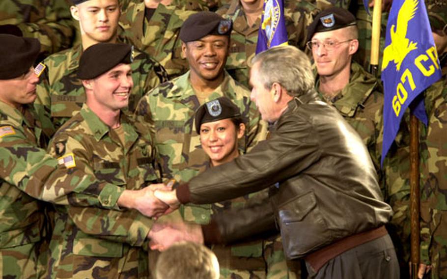 President Bush shakes hands with the troops Saturday at Osan Air Base.