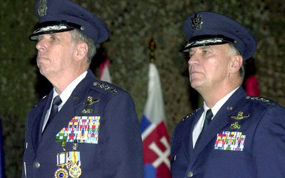 Air Force Gen. Robert H. "Doc" Foglesong, left, and Gen. Tom Hobbins stand together during the U.S. Air Forces in Europe change of command ceremony.