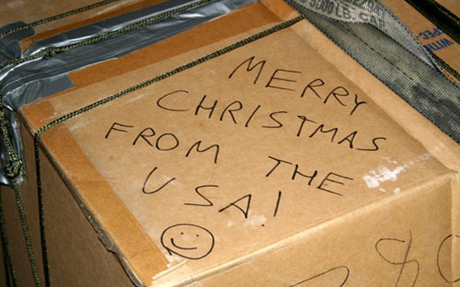 One of the 55 boxes packed for the 2005 Christmas Drop bears a message written by one of dozens of volunteers on Andersen Air Force Base, Guam, who packed the boxes to be dropped earlier this week to residents of remote Micronesian islands.