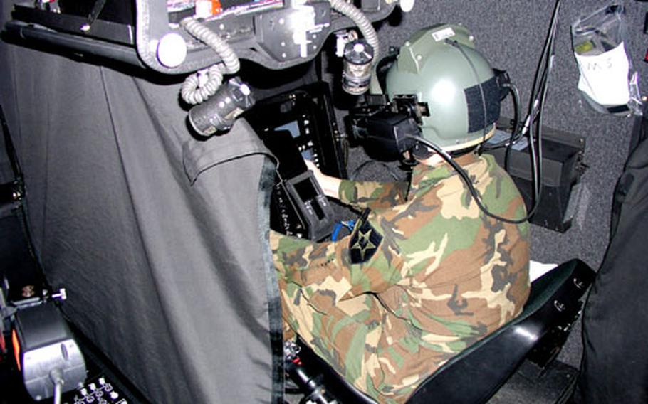 An AH-64D Apache Longbow crew takes part in a mock combat mission inside a high-tech helicopter flight simulator at Camp Humphreys in South Korea. The crew was 1st Battalion, 2nd Aviation Regiment, part of the 2nd Infantry Division’s 2nd Combat Aviation Brigade.