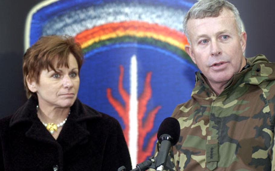 Gen. David D. McKiernan and his wife, Carmen, meet the media following the change of command ceremony in Heidelberg, Germany, on Wednesday.