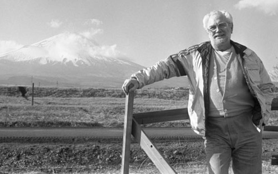 On a USO tour of Japan in 1982, comedian Foster Brooks performs for Marines at Camp Fuji; shakes hands with Cpl. Richard Carlson after a game of pool; and poses with Mt. Fuji in the background.