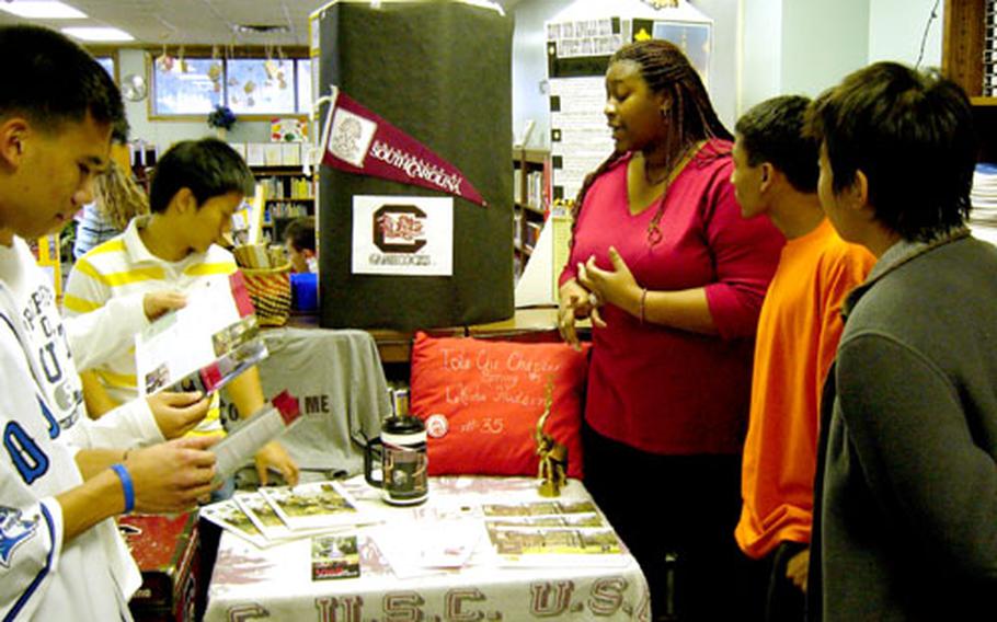 At Pusan American School in South Korea in fall 2005, students attend a college fair set up to foster schoolwide interest in college attendance. The school is on Camp Hialeah in Busan. Both the school and the installation are set to close later this year.