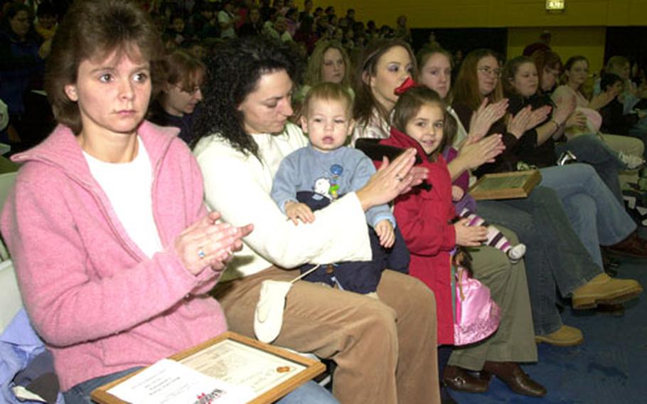 Family members wait for their loved ones during Tuesday morning’s ceremony in which troops from Company A, 94th Engineer Battalion returned to Hohenfels, Germany, following a yearlong tour in Iraq.