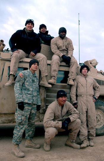 The Tactical Movement Team turret gunners pose in Iraq.