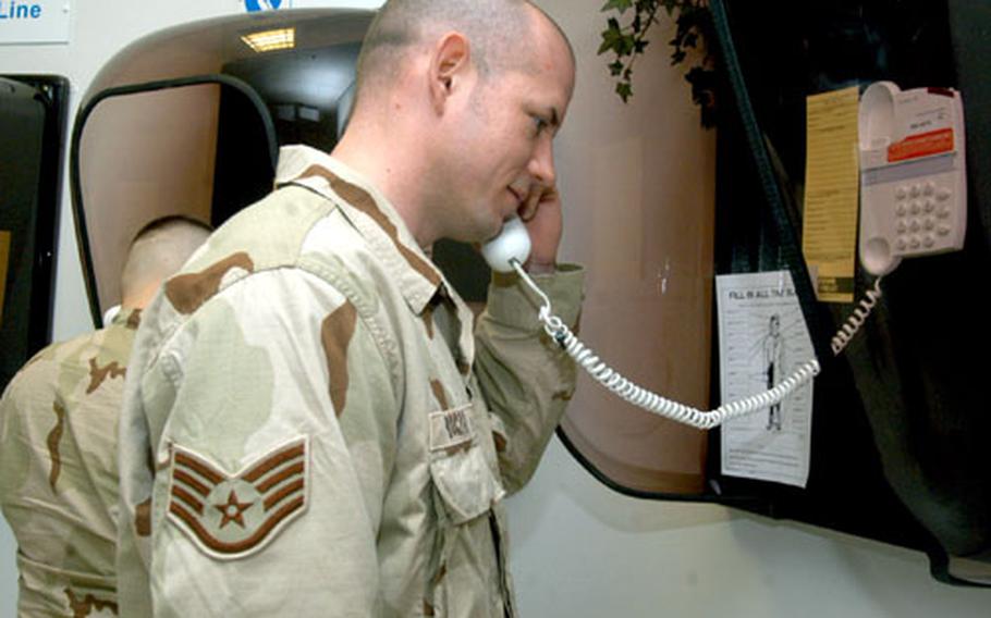 Staff Sgt. Stephan Boczar, a crew chief with the 352nd Maintenance Squadron, makes one last call at the RAF Mildenhall passenger terminal before deploying.